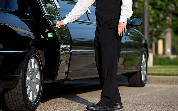 man opening limo door